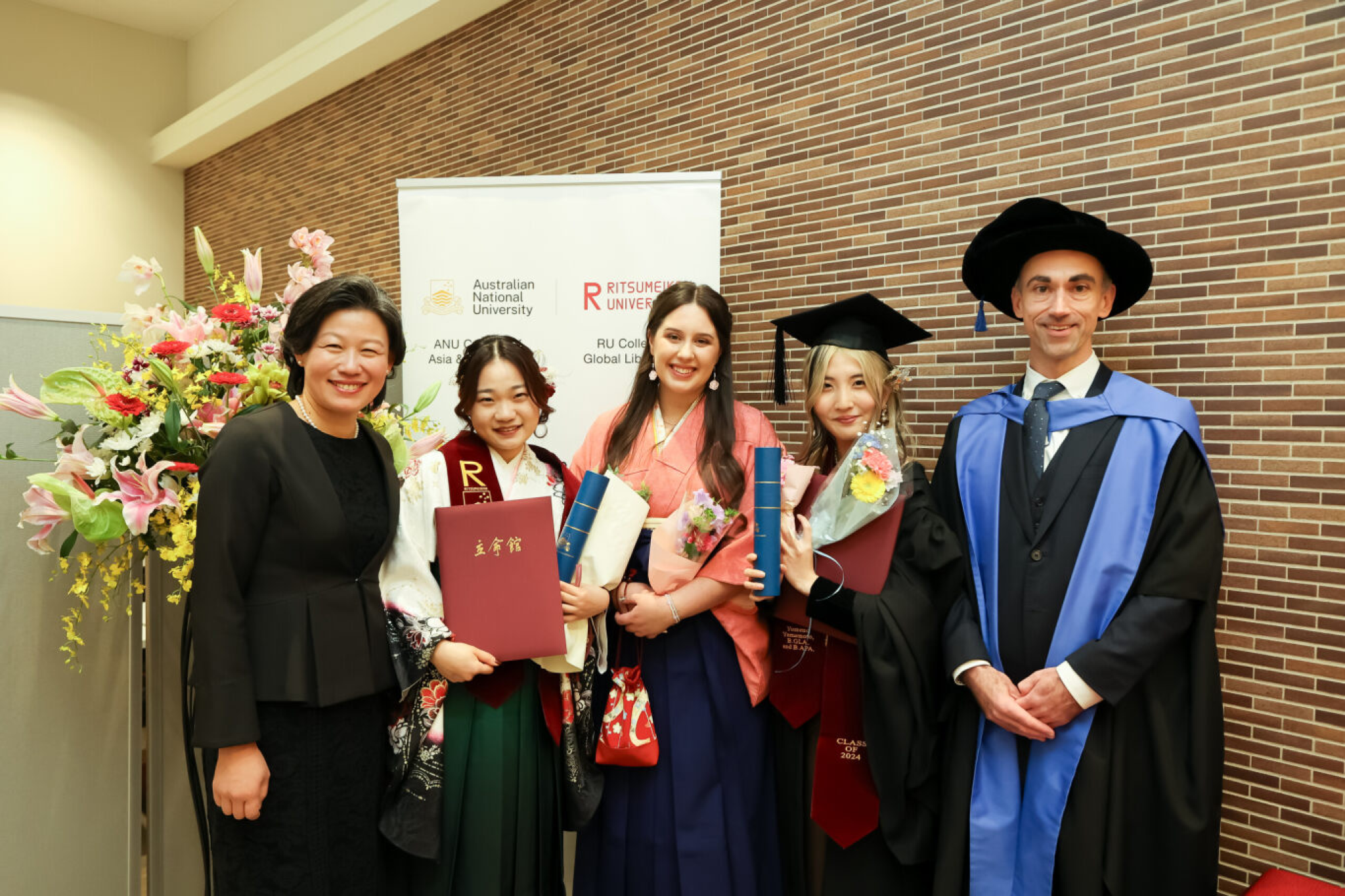 Graduates with RU staff and Dr Christopher Hobson from ANU